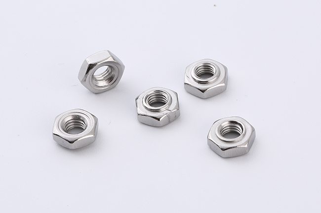 Close-up of metallic industrial hex nuts