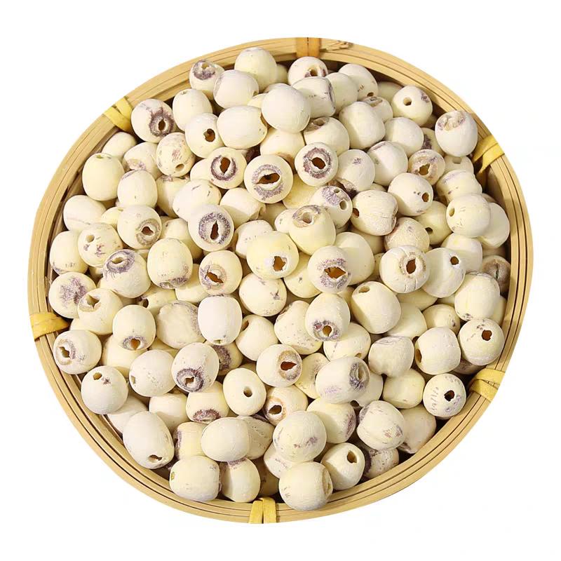 Dried lotus seeds in a bamboo basket