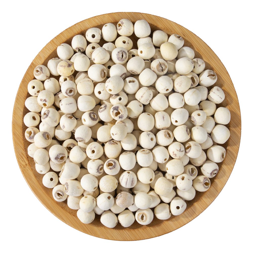 Peeled white lotus seeds in a woven basket